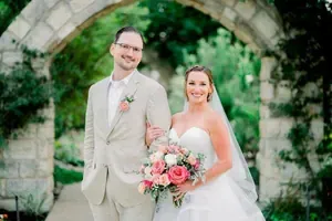 Elegant reception hall setup with floral arrangements